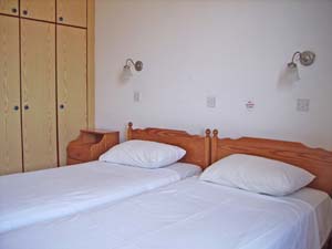 4 person standard apartment with inland view, balcony, an extra bed, and private facilities (bath and shower)